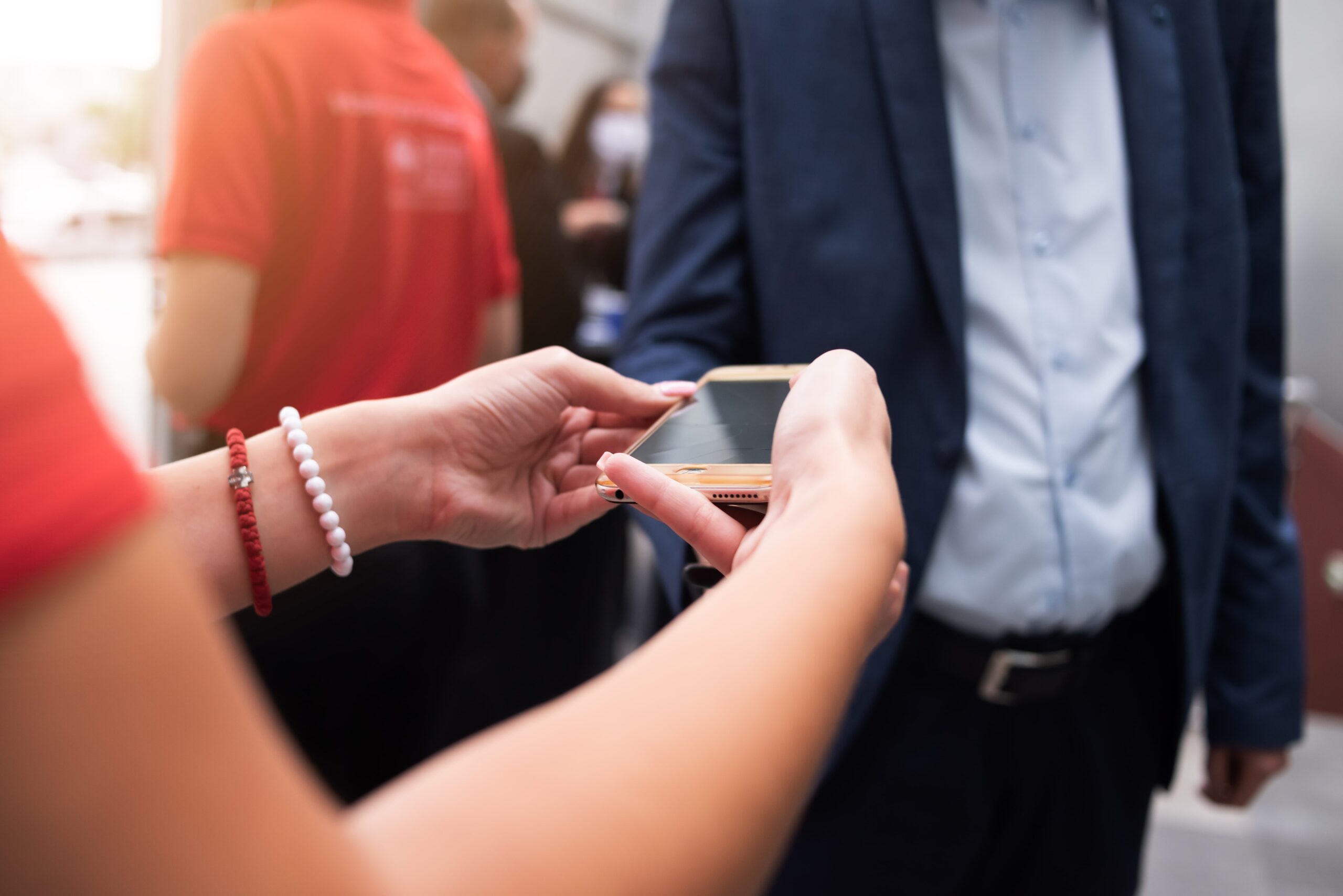 A woman is scanning tickets before an event